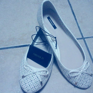 White ballet flat shoes